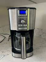 Front view of Cuisinart coffee maker with digital control panel and glass carafe