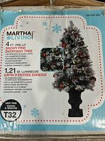 Box of Martha Stewart Living 4ft pre-lit snowy pine entryway Christmas tree showing product details and features