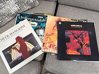 Photo showing pile of vinyl records including Chuck Mangione Live at the Hollywood Bowl and Sammy Davis Jr. The Conspirators