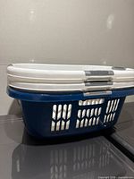 Three stacked laundry baskets showing color and condition