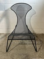 Frontal view showing high back, seat, and sled base