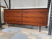 Full front view of dresser showing all six drawers and tapered legs