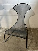 Front view of chair showing high back and seat shape
