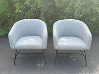 Two chairs side by side front view outdoors