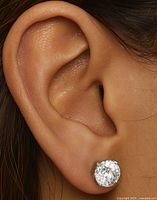 Earring worn on ear showing scale and fit