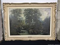 Framed oil painting showing entire artwork and frame with visible wear.