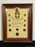 Framed 10-piece Newfoundland pre-Confederation coin collection showing all coins and coat of arms