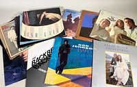 Photo of assorted vintage vinyl record albums showing album cover artwork and titles including Don Johnson, LightHouse, The Backbeats, and more.