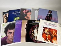 Lot of vintage vinyl record albums grouped together showing various classic soul and Motown artists with visible wear on album covers.