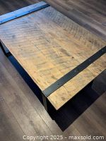 Full top view of coffee table showing weathered wood surface and metal support bands.