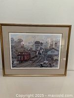 Framed limited edition print showing an early 20th-century scene at the Unionville train station with trains and vintage automobiles.