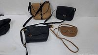 Group shot of four handbags