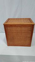 Front view of rectangular wooden woven hamper