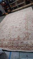 Full view of wool rug laid flat showing overall pattern and size