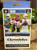 Front of sealed 2020 Panini Chronicles Football hanger box showing rookie QBs and 30-card label