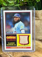 Front view of Vladimir Guerrero Jr Topps Heritage Clubhouse Collection bat relic card in holder