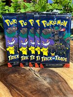 Front view of five sealed Pokémon Trick or Trade booster packs