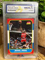 Front of encapsulated Michael Jordan Fleer card showing dunk image and WCG Gem Mint 10 label