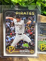 Front view of Paul Skenes Topps rookie card with second rookie card partially visible behind