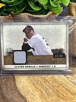 Front view of Elston Howard Legendary Memorabilia jersey relic card showing fabric swatch and overall design