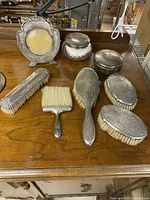 Full set showing brushes, jars, picture frame