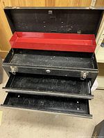 Toolbox open showing removable red tray, drawers extended, overall condition