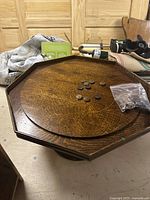 Full view of octagonal crokinole table with discs on top