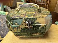 Octagonal wooden decoupage handbag exterior with latch and rope handle