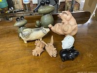 All ceramic ornaments displayed together on wooden surface