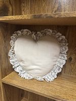 Heart-shaped lace-trim pillow