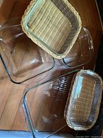 Glass casseroles in wicker baskets