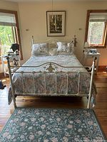 Full view of assembled white metal queen bedframe
