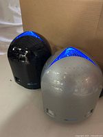 Black Airfree Model 3000 and silver Model 2000 air purifiers frontal view