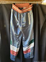 Front view of multicolour Adidas Bristol Studio sweat pants