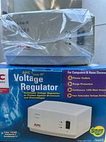 APC Line-R 1200 regulator on top of retail box, shrink-wrapped