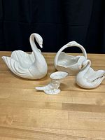 Group shot of four Lenox ivory porcelain pieces
