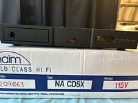 Front and top of Naim CD5X player resting on original box showing brand, model and serial