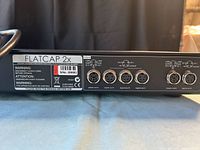 Rear view of Naim Flatcap 2x with serial label and DIN connectors
