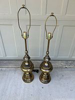 Full view of both lamps with harps and finials visible