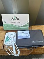 All components: retail box, pulser unit, case, manual