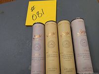 Four Saje Natural Wellness oil roll-on tubes side by side