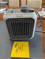 Front view of DeLonghi heater showing grille and overall condition