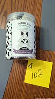 Container front showing label Buddy Clip Clover the Cow Black Raspberry Vanilla