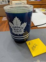 Front view of Scentsy warmer showing logo and wax inside dish