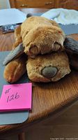 Front view of brown Snuggle Puppy plush