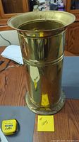 Full front view of brass umbrella stand