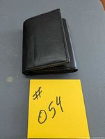 front view of folded black leather wallet
