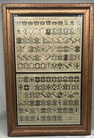 Front view of framed engravings showing both plates and frame detail