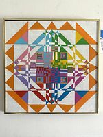 Front view of framed multicolor geometric painting