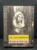 Full front view of Kati Elm collage showing entire artwork, text strips, and surrounding printed background.